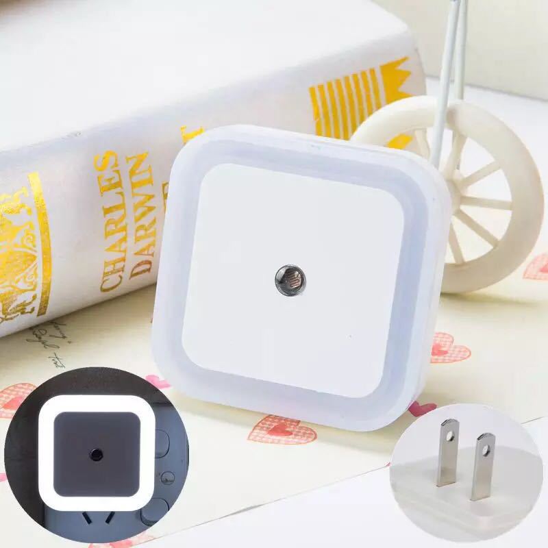 Arenzza LED smart light control sensor for energy-saving lamps, mounted on a wall in a modern kitchen setting.