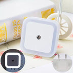 Arenzza LED smart light control sensor for energy-saving lamps, mounted on a wall in a modern kitchen setting.