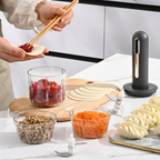 Arenzza home use wireless electric meat grinder in black, showing the compact kitchen appliance with stainless steel components
