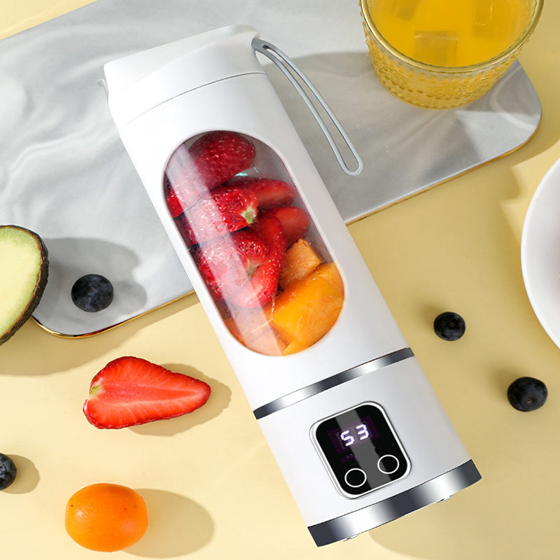 Arenzza portable cordless juicer in white with a transparent juice container, showing its compact design for kitchen and houseware use.