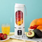 Arenzza portable cordless juicer in white with a transparent juice container and black lid, designed for quick fruit and vegetable juicing.