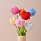 Handmade crochet roses and tulips jewelry accessories by Arenzza featuring colorful floral designs in detailed craftwork.