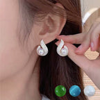 Arenzza elegant simulated pearl and rhinestone stud earrings with a sparkling jewelry accessory design on a white background.