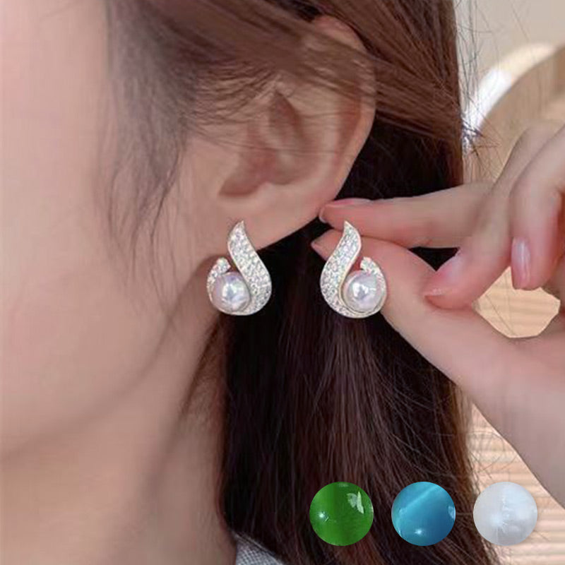 Arenzza elegant simulated pearl and rhinestone stud earrings with a sparkling jewelry accessory design on a white background.