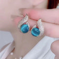 A pair of Arenzza elegant simulated pearl and rhinestone stud earrings with sparkling accents, showcasing jewelry accessories.