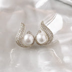 Elegant Arenzza simulated pearl and rhinestone stud earrings with a sparkling, sophisticated design for jewelry accessories.
