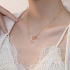 A women's elegant Bell Orchid necklace by Arenzza featuring a delicate floral pendant on a fine chain jewelry accessory.