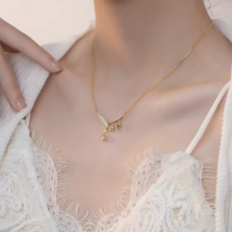 A women's elegant Bell Orchid necklace by Arenzza featuring a delicate floral pendant on a fine chain jewelry accessory.