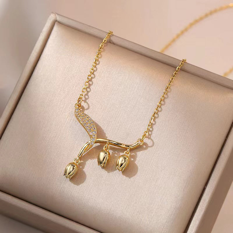 Women's elegant bell orchid necklace from Arenzza, showcasing delicate floral jewelry accessory with intricate design.