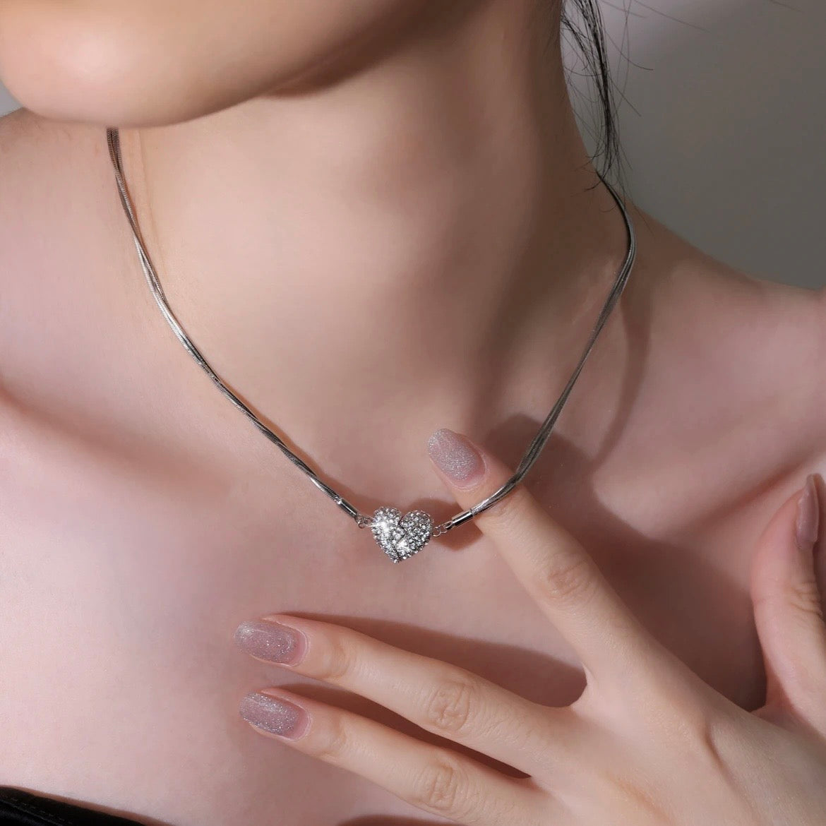 Aarenza love heart pendant with embedded diamonds on a delicate magnetic necklace, jewelry accessory with a romantic design.
