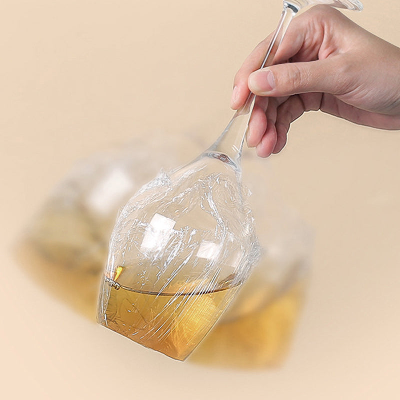 Arenzza Easy-Cut Stretch Clear Food Wrap in a kitchen setting, showing the transparent, flexible plastic food wrap for storage.