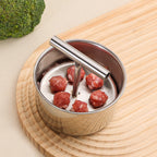 Aarenza stainless steel meatball mould for kitchen use, with multiple circular compartments for shaping meatballs.