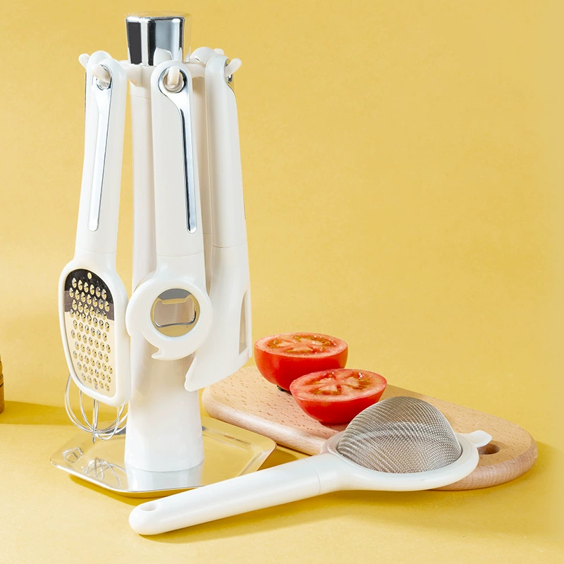 Arenzza 7-piece kitchen gadget set including spatulas, tongs, and utensils arranged on a white background.