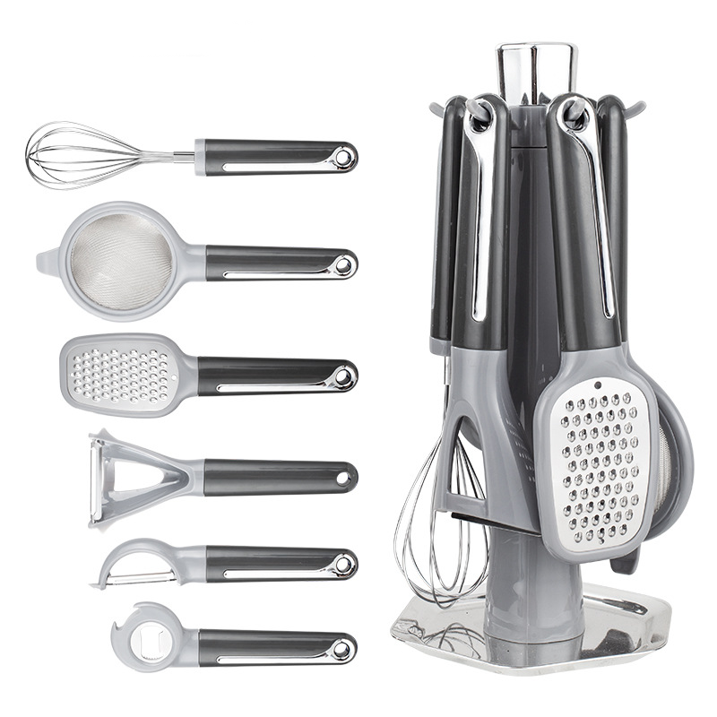 Arenzza 7-piece kitchen gadget set with spatulas, tongs, and utensils arranged on a countertop for cooking and baking.