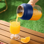 Arenzza large capacity electric fruit juicer on a kitchen countertop with fruits and juice glass in the background.