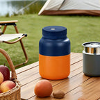 Arenzza large capacity electric fruit juicer on a kitchen countertop with orange and apple juice in clear glasses.