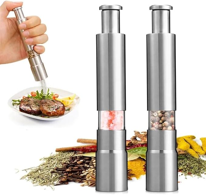 Arenzza professional grade salt, pepper, and spice grinder with refillable glass chambers on a kitchen countertop.