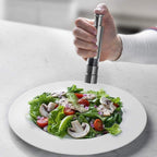 Arenzza professional-grade salt, pepper, and spice grinder with refillable glass chambers for kitchen seasoning.