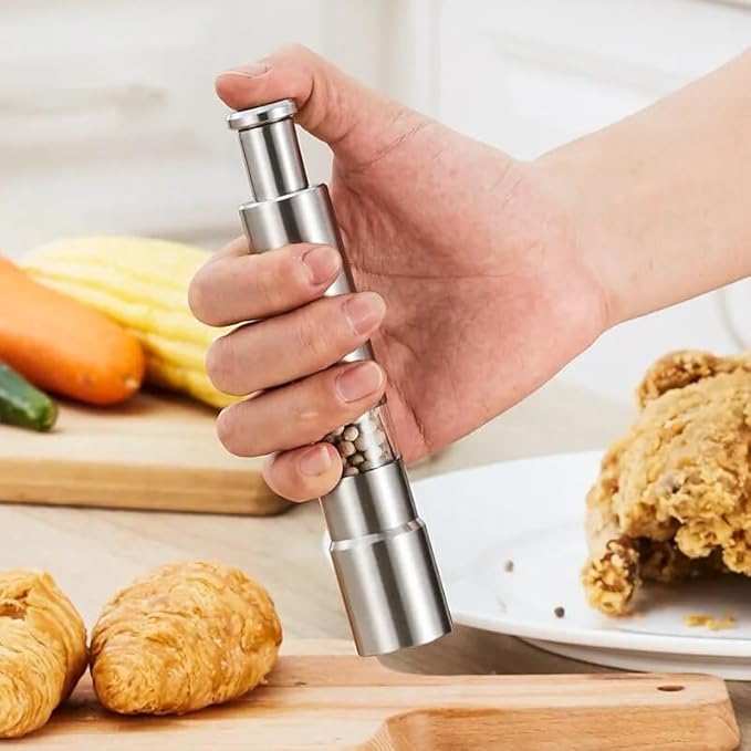 Arenzza professional kitchen salt, pepper, and spice grinder with refillable glass chambers on a countertop.