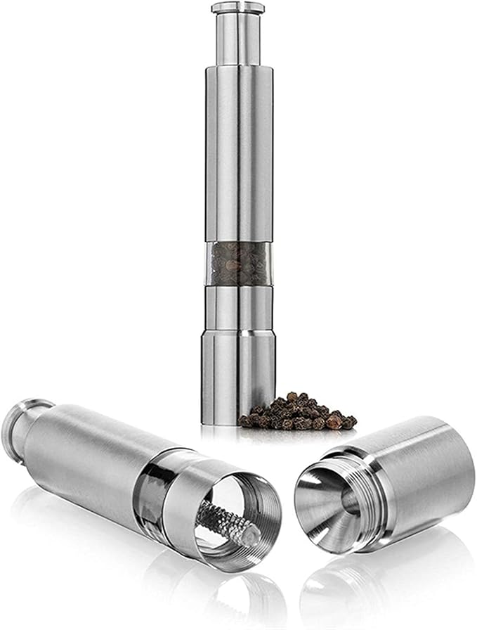 Arenzza professional grade salt, pepper, and spice grinder with refillable glass chambers on a kitchen countertop.