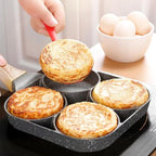 Arenzza four-hole non-stick egg pan for breakfast omelettes, featuring four cooking sections on a kitchen frying pan.