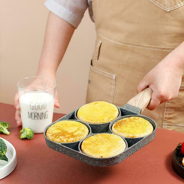 Arenzza four-hole non-stick egg pan for breakfast omelettes, featuring four cooking sections and a durable kitchen design.