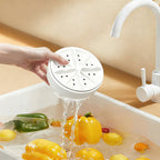 Arenzza vortex fruit and vegetable washer in a kitchen setting, showing the device with fresh produce ready for cleaning.