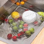 Arenzza Vortex Fruit and Vegetable Washer in a kitchen setting, showing a clear view of the compact, stainless steel appliance in use.