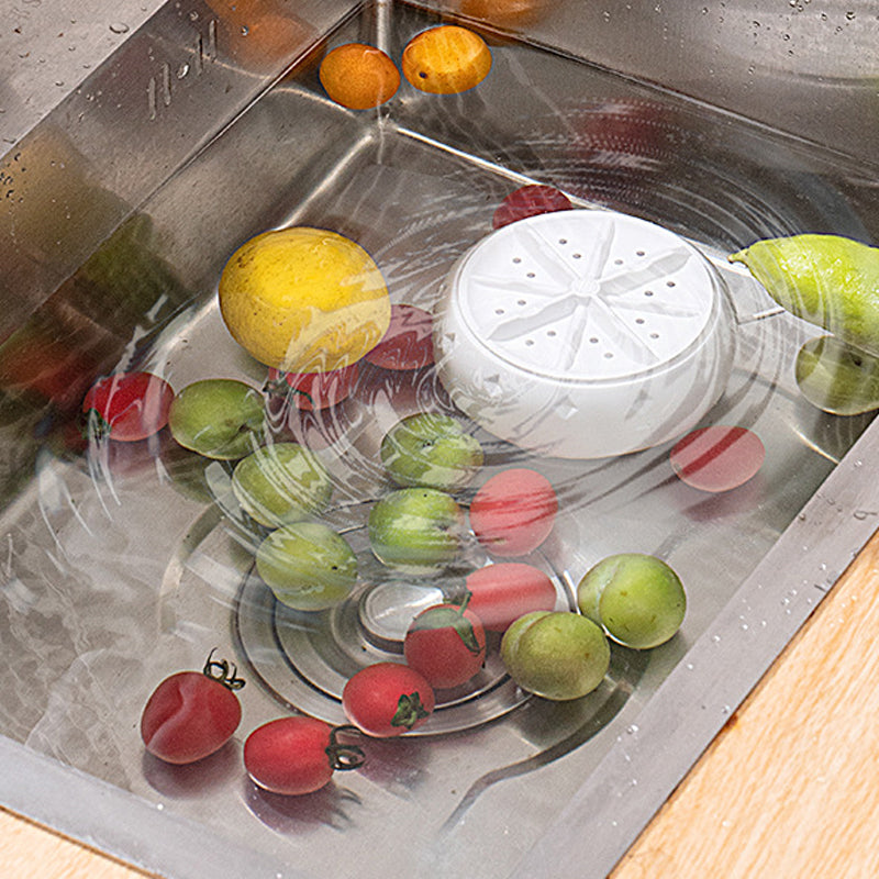 Arenzza Vortex Fruit and Vegetable Washer in a kitchen setting, showing a clear view of the compact, stainless steel appliance in use.