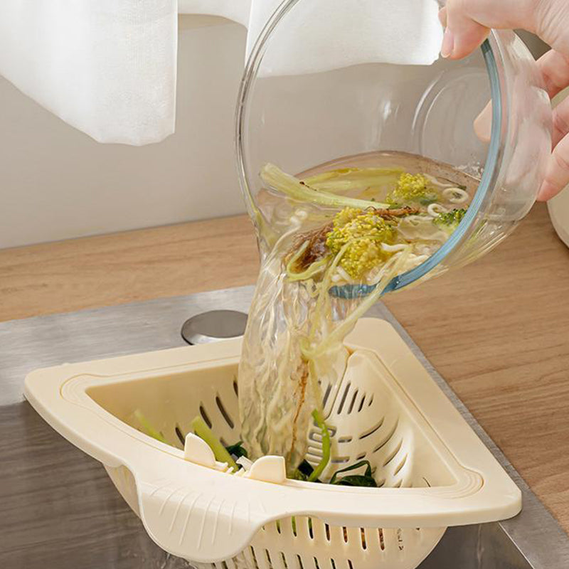 Arenzza magnetic suction space-saving corner sink strainer in a kitchen setting with a black finish and compact design.