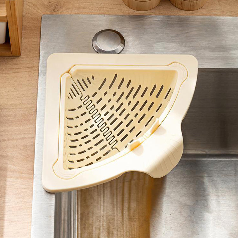 Arenzza magnetic suction space-saving corner sink strainer in a kitchen, designed to catch debris and save counter space.