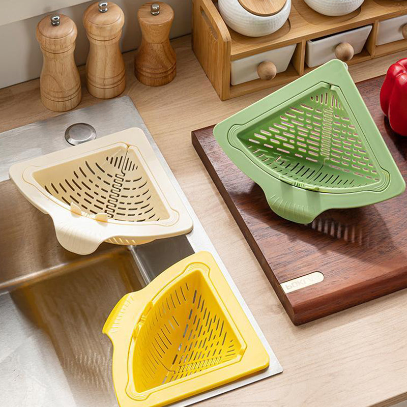 Arenzza magnetic suction space-saving corner sink strainer in a modern kitchen, fitting into a corner drain for efficient water drainage.