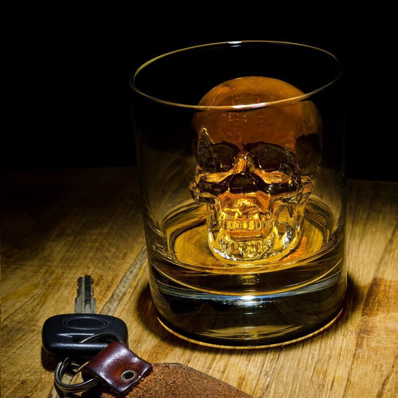 Aarenza silicone skull ice cube tray with large skull molds for making slow-melt ice cubes for whiskey and cocktails.