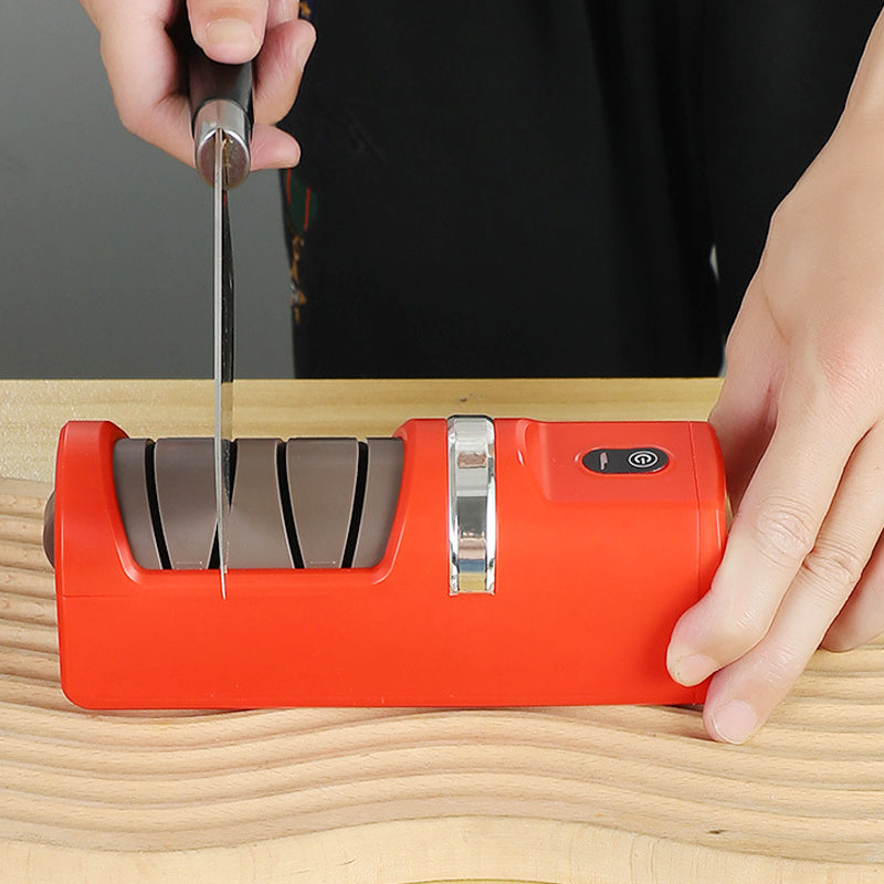 Arenzza automatic kitchen knife sharpener with stainless steel body and multiple sharpening slots on a kitchen countertop.