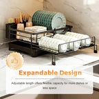 Arenzza kitchen countertop organizer and dish drying rack with multiple compartments for utensils, plates, and cups on a kitchen counter.