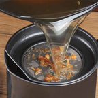Arenzza stainless steel kitchen oil jar with a sleek, modern design, featuring a spout for easy pouring and a secure lid.