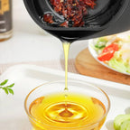 Arenzza stainless steel kitchen oil jar with a sleek, modern design, perfect for storing cooking oil in the kitchen.