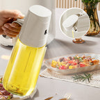 Arenzza leak-proof glass oil bottle with spray and pour spout for kitchen use, featuring a clear glass body and black lid.