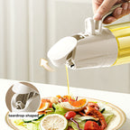 Arenzza leak-proof glass oil bottle for spray and pouring, designed for kitchen use with a clear glass body and adjustable spray nozzle.