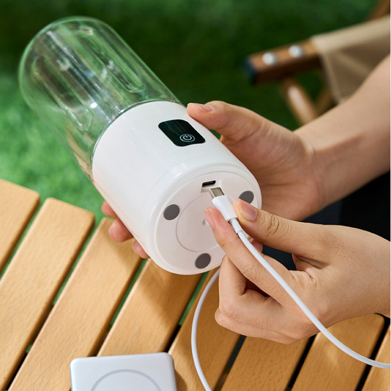 Arenzza portable wireless juicer with a 12-blade system, compact kitchen appliance for fresh fruit and vegetable juices.