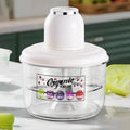 Arenzza portable automatic electric fruit peeler on a kitchen countertop, showing its compact design and peeled fruit in action.
