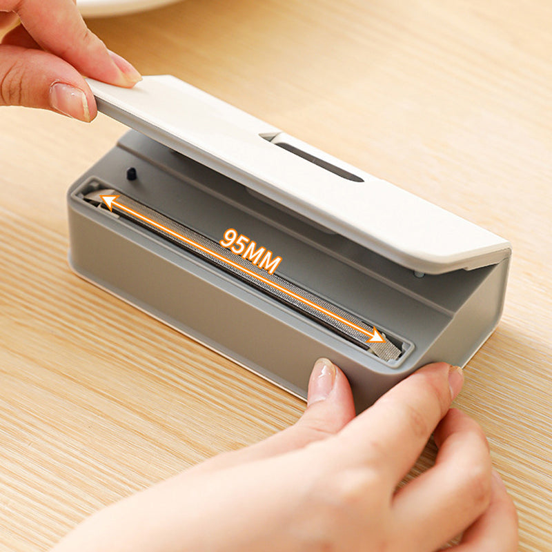 Arenzza rechargeable 2-in-1 mini bag sealer with built-in cutter for kitchen use, compact and easy to operate.