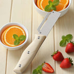 Arenzza multi-functional kitchen peelers with ergonomic handles, displayed on a countertop for versatile peeling tasks.