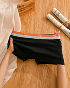 A pair of Arenzza men's boxer briefs made of breathable antibacterial bubble cotton, shown in black with a snug fit.