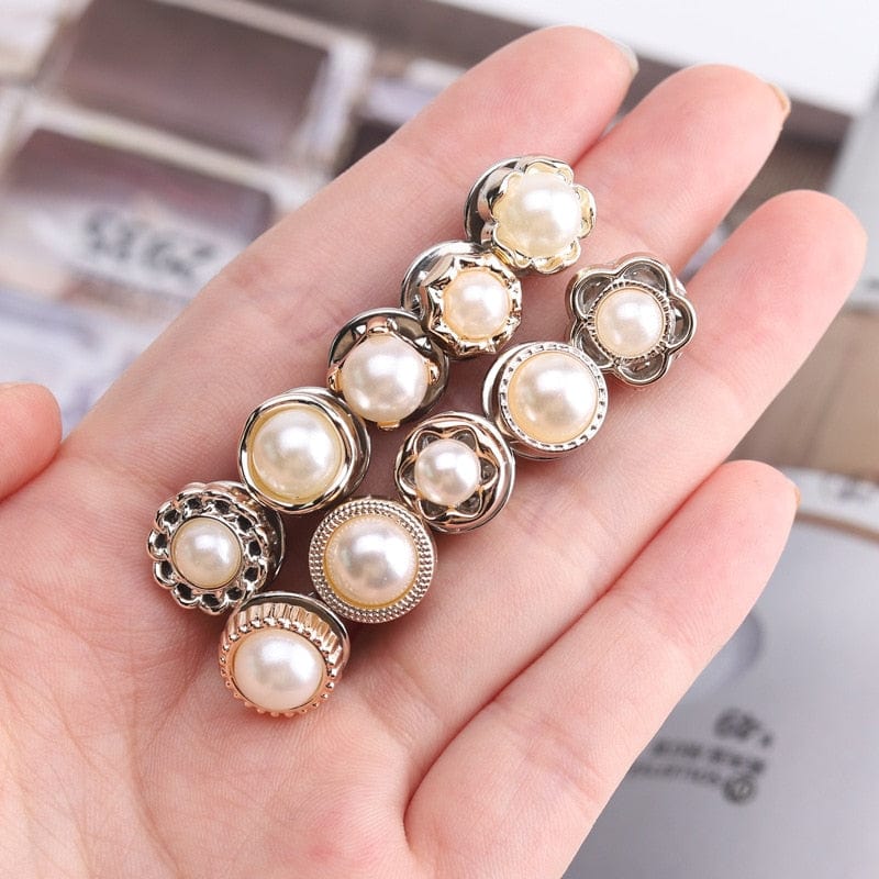 A close-up of Arenzza MetalSnap premium metal buttons with a sleek silver finish, showcasing their round shape and textured surface.