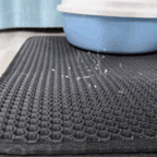 Aarenza non-slip cat litter mat for pet supplies, showing a textured rubber surface designed to catch litter around a cat's litter box.