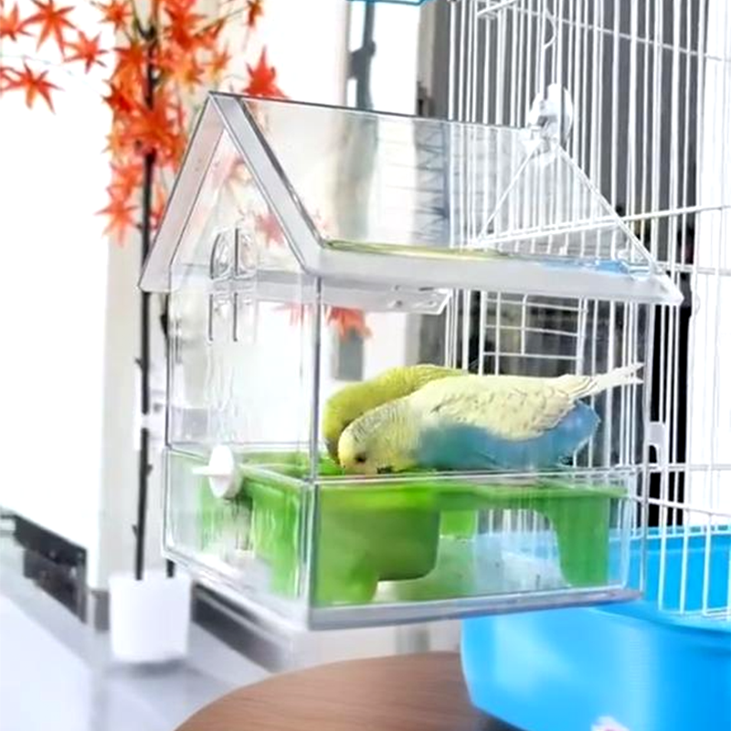 Arenzza pull-out external parrot feeder attached to a cage, made of durable plastic with a clear tray for easy refilling.