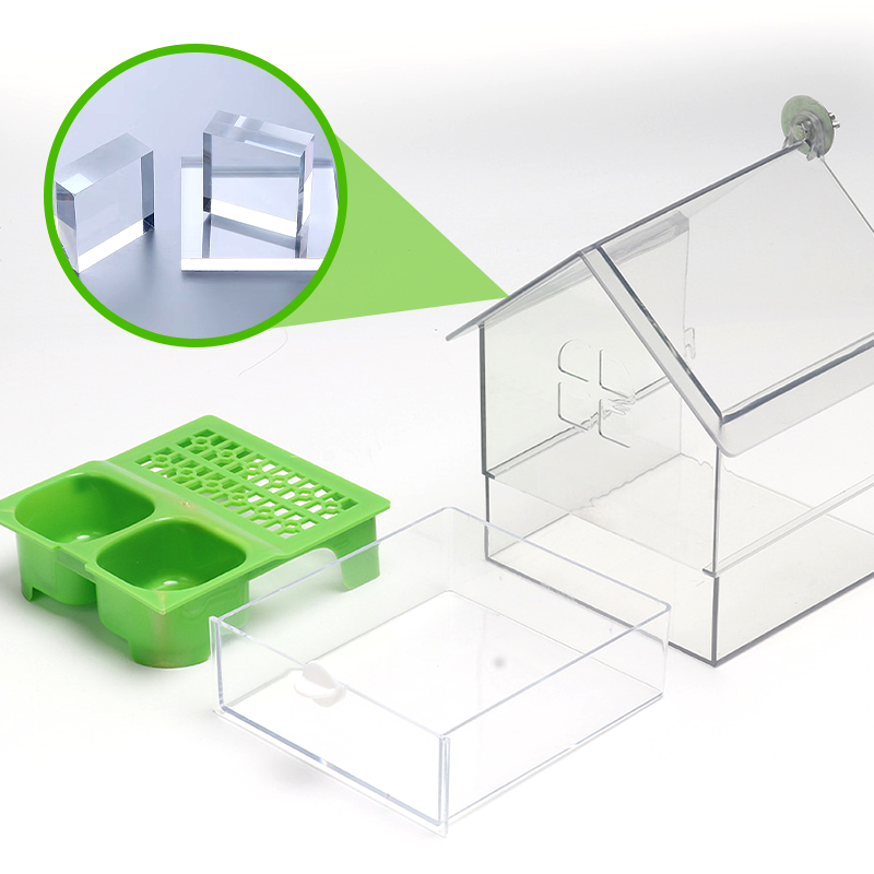 Arenzza pull-out external parrot feeder in pet supplies, featuring a clear container and removable tray for easy bird feeding.