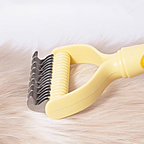 Arenzza dual-sided pet grooming rake with stainless steel teeth for easy brushing and shedding control in pet grooming.
