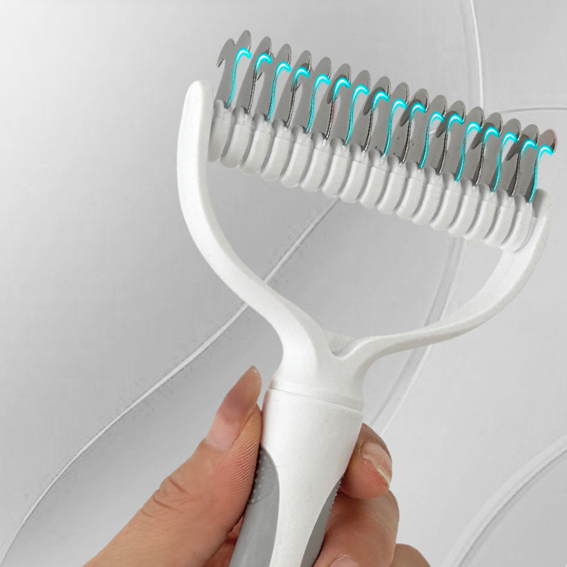 Aarenza dual-sided pet grooming rake with ergonomic handle, designed for grooming dogs and reducing shedding mess.